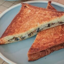 A plate of mushroom toast sandwich