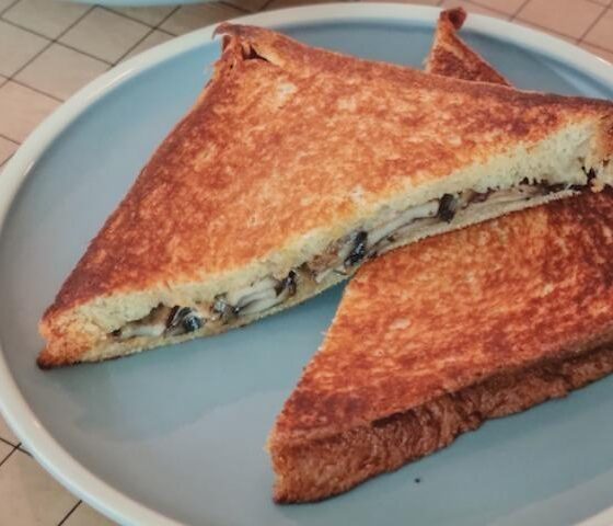 A plate of mushroom toast sandwich